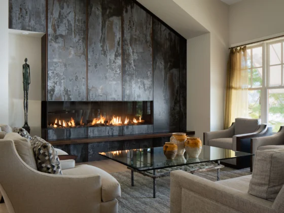 modern linear fireplace with dark metal surround in contemporary living room interior