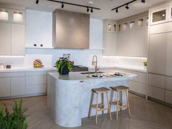 modern kitchen display with quartz island countertop and custom cabinetry at Richstone Surfaces showroom