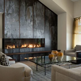 modern linear fireplace with dark metal wall surround in contemporary living room interior