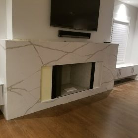 modern fireplace with calacatta quartz surround and minimalist living room design