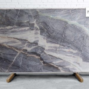 Aurora Borealis natural stone surface with vibrant multicolor crystalline patterns in blue, green, and gold for luxury decorative countertops and feature surfaces
