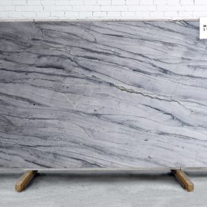 Blue Noir Polished natural stone surface with deep blue and black tones and subtle flowing veining for luxury kitchen and bathroom countertops
