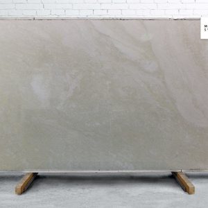 Branco Itacare Polished natural stone surface with soft white background and subtle grey veining for elegant kitchen and bathroom countertops