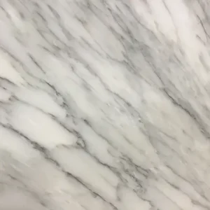 Calacatta Altissimo marble slab with bright white background and striking gray veining for luxury kitchen countertops and premium interior surfaces