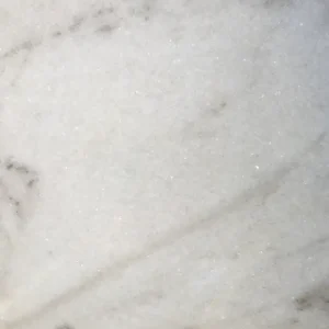 Calacatta Castelo marble slab with white background and bold gray veining ideal for luxury kitchen countertops and interior stone designs