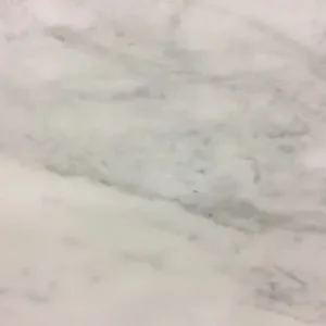 Calacatta marble slab with bright white background and bold gray veining ideal for luxury kitchen countertops and interior stone surfaces