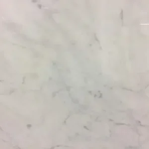 Carrara White Extra marble slab with elegant white background and subtle gray veining for luxury kitchen countertops and interior surfaces