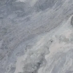 Fantasy Blue natural stone slab with blue grey tones and flowing veining for luxury countertops and interior surfaces