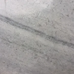 Fantasy White natural stone slab with soft white background and flowing grey veining for countertops and interior surfaces