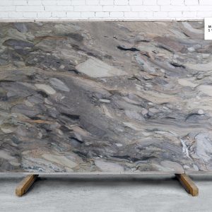 Fusion Explosion Polished natural stone surface with dramatic multicolor veining in gold, grey, and black for luxury countertops and statement surfaces
