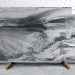 Magnus Polished natural stone surface with deep grey tones and bold natural veining for modern kitchen and bathroom countertops