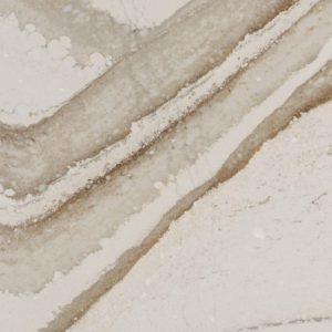 Brittanicca Gold quartz countertop slab with white base and bold gold veining for luxury kitchen and bathroom surfaces